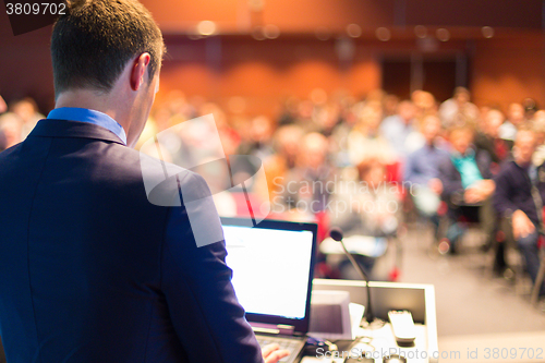 Image of Public speaker at Business Conference.