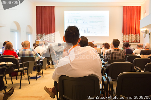 Image of Speaker at Business Conference and Presentation.