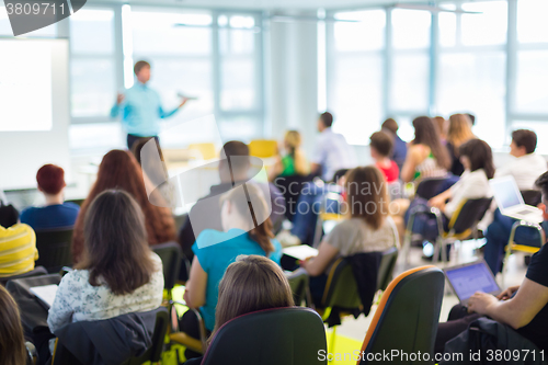 Image of Speaker at Business convention and Presentation.