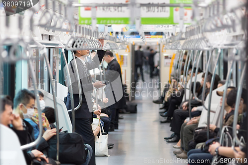 Image of Passengers traveling by Tokyo metro.