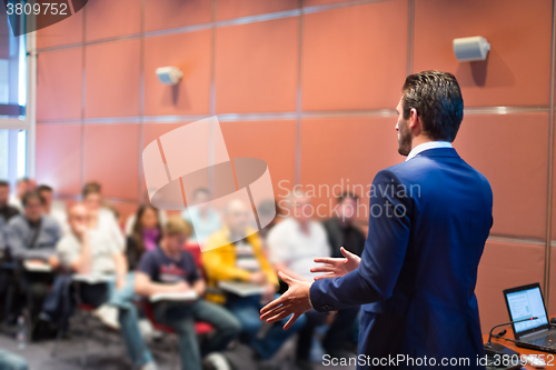 Image of Speaker at Business Conference and Presentation.