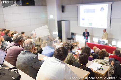 Image of Speaker at Business Conference and Presentation.
