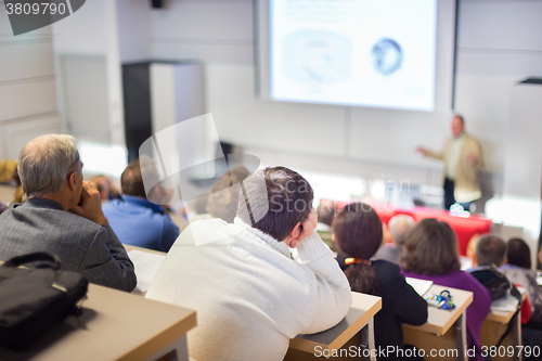 Image of Speaker at Business Conference and Presentation.