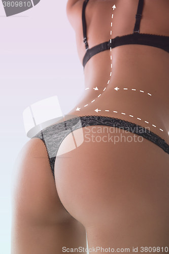 Image of Woman with correction lines in thong. On white background. perfect ass
