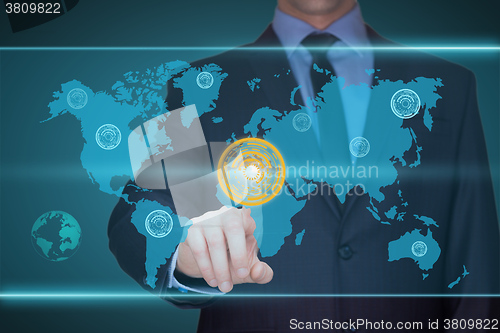 Image of business, technology, internet and networking concept - businessman pressing button with contact on virtual screens. World map