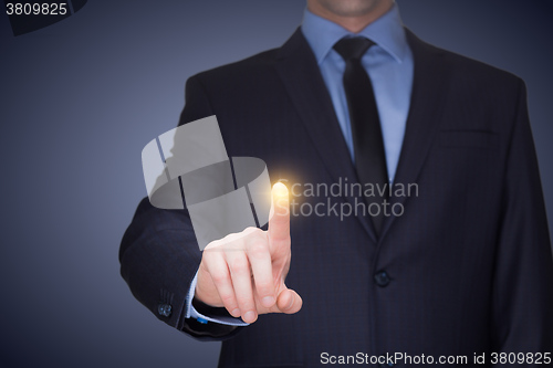 Image of business, technology, internet and networking concept - businessman pressing button with contact on virtual screens. 