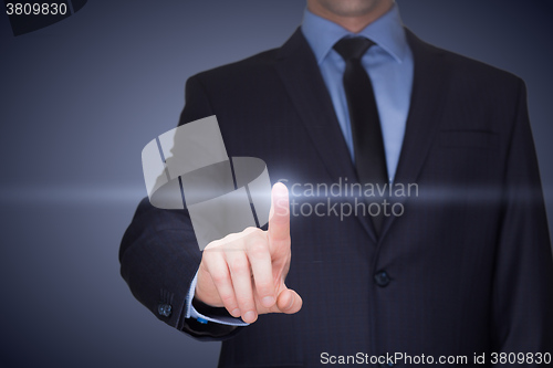 Image of business, technology, internet and networking concept - businessman pressing button with contact on virtual screens. 