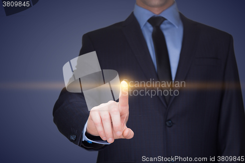 Image of business, technology, internet and networking concept - businessman pressing button with contact on virtual screens. 