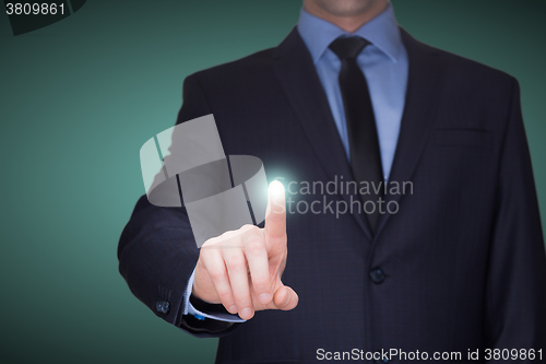 Image of business, technology, internet and networking concept - businessman pressing button with contact on virtual screens. 