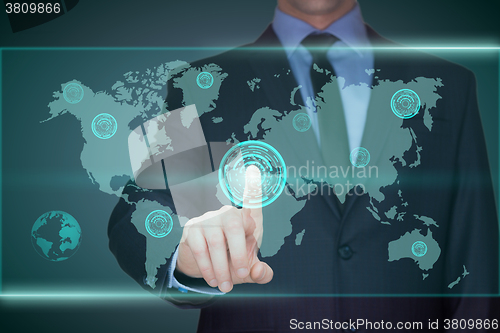 Image of business, technology, internet and networking concept - businessman pressing button with contact on virtual screens. World map