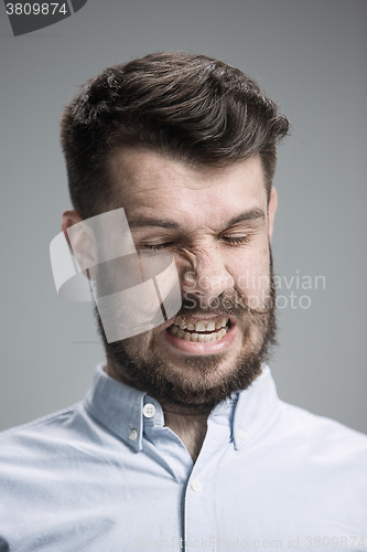 Image of portrait of disgusted man