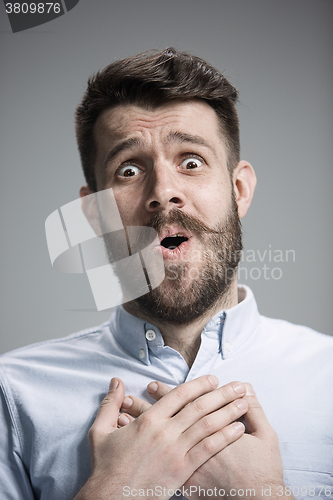 Image of Man is looking imploring over gray background