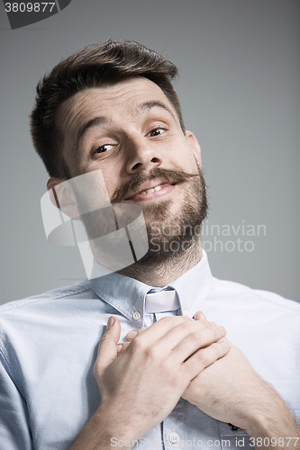 Image of Man is looking imploring over gray background