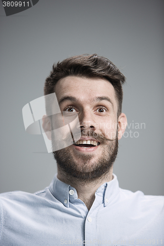 Image of The  young man looking at camera 