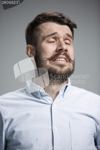 Image of The crying man with tears on face closeup