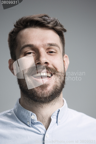 Image of The  young man looking at camera 