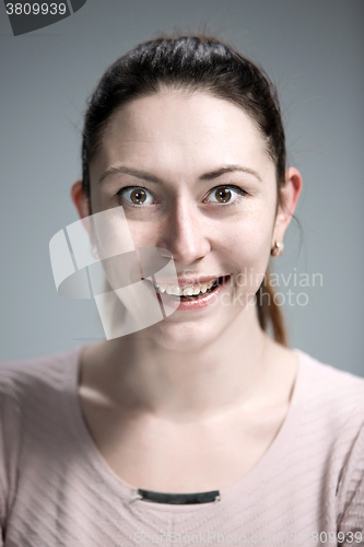 Image of The happy woman on gray background