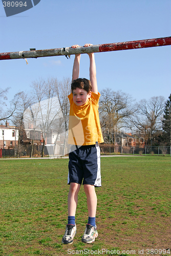 Image of Boy hanging on