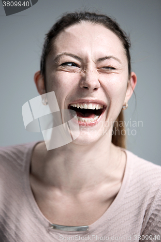 Image of The happy woman on gray background