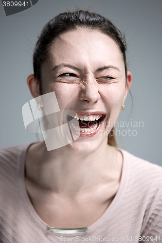 Image of The happy woman on gray background