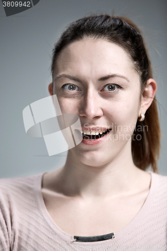 Image of The happy woman on gray background