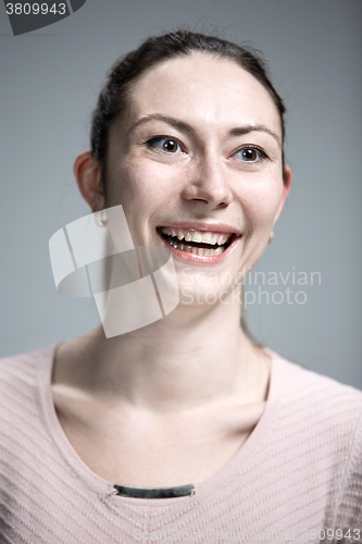 Image of The happy woman on gray background
