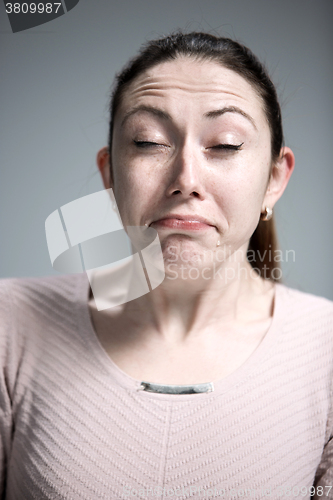 Image of The crying woman with tears on face closeup