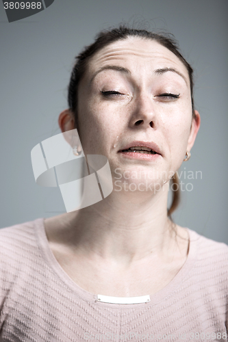 Image of The crying woman with tears on face closeup