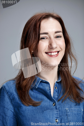 Image of The happy woman on gray background