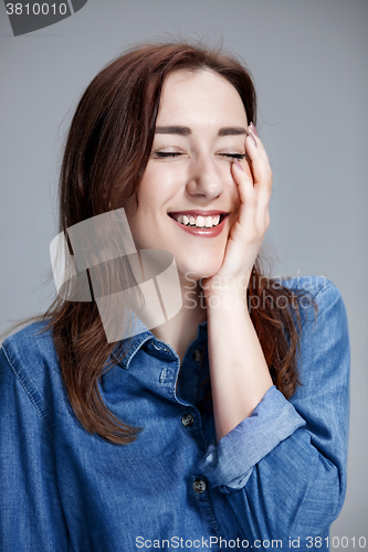 Image of The happy woman on gray background