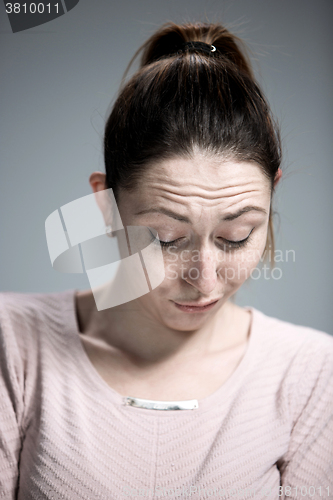 Image of The portrait of a beautiful sad girl closeup