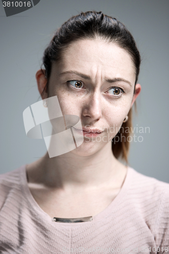 Image of The portrait of a beautiful sad girl closeup