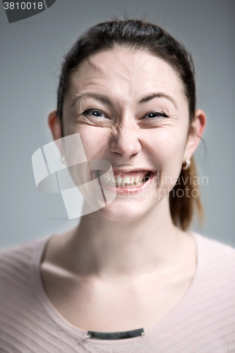 Image of The happy woman on gray background