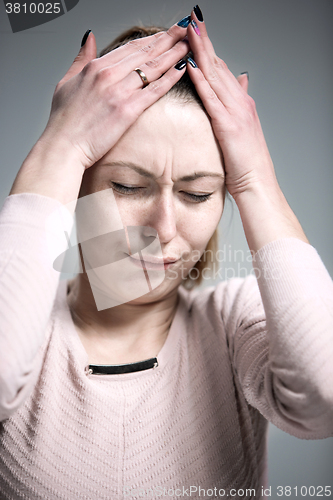 Image of The portrait of a beautiful sad girl closeup