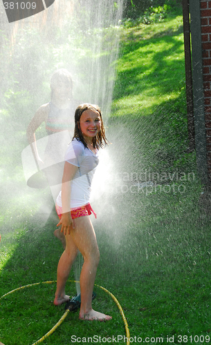 Image of Girls and sprinkler