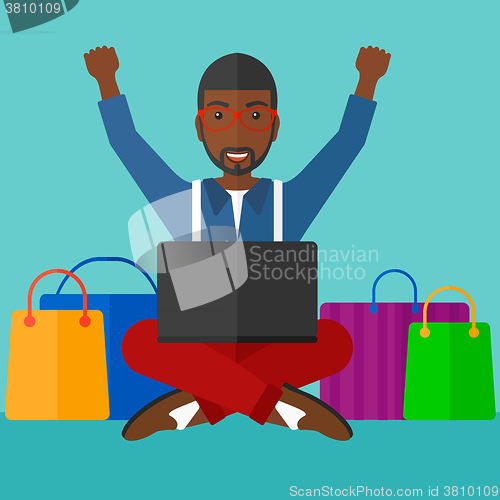 Image of Man making purchases online.