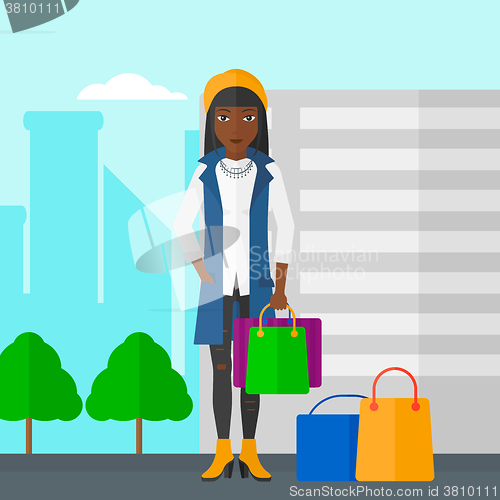 Image of Buyer with shopping bags.