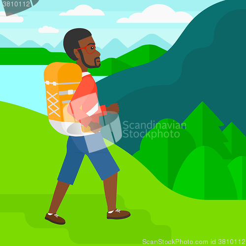 Image of Man with backpack hiking.