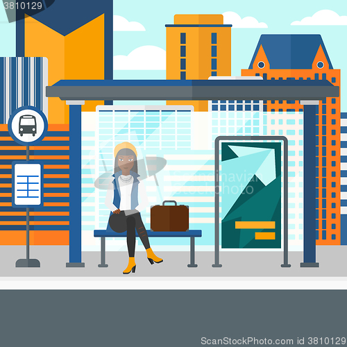 Image of Woman waiting for bus.