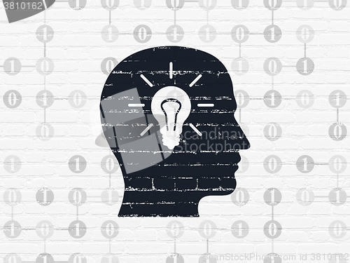 Image of Business concept: Head With Light Bulb on wall background