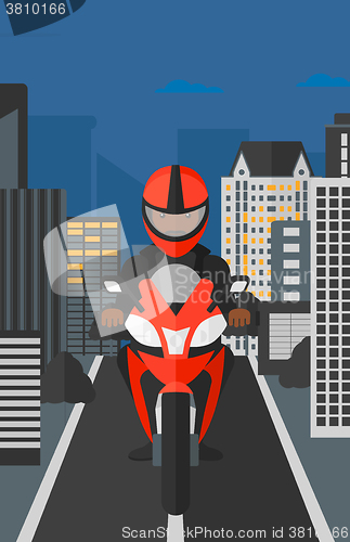 Image of Man riding motorcycle.