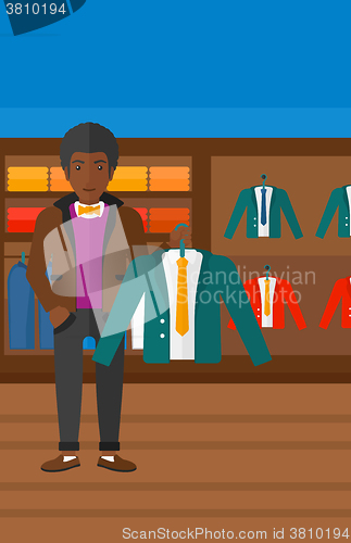 Image of Man holding jacket.