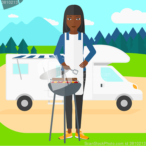 Image of Woman preparing barbecue.