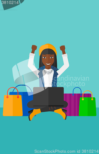 Image of Woman making purchases online.