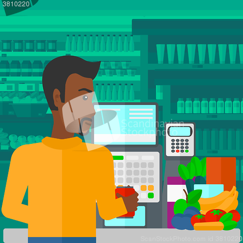 Image of Cashier at supermarket checkout.