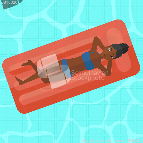 Image of Woman relaxing in swimming pool.