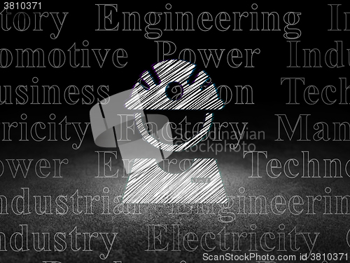 Image of Industry concept: Factory Worker in grunge dark room