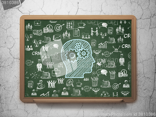 Image of Business concept: Head With Gears on School Board background