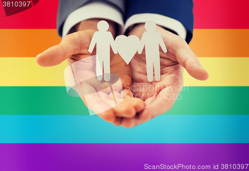 Image of close up of happy male gay couple with love symbol