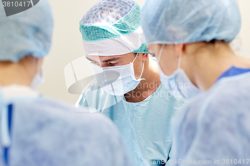 Image of group of surgeons in operating room at hospital